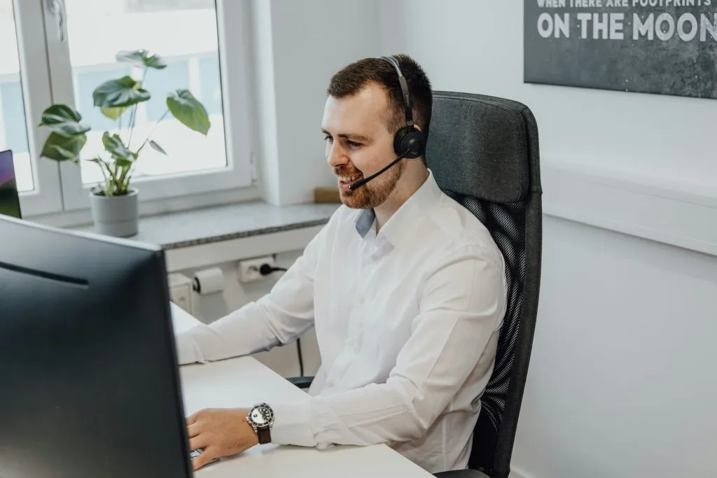 male telemarketer at his computer